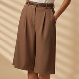 calções compridos castanhos